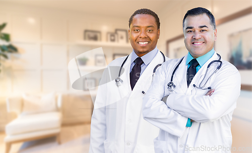 Image of African American and Hispanic Doctors or Nurses Standing in Offi