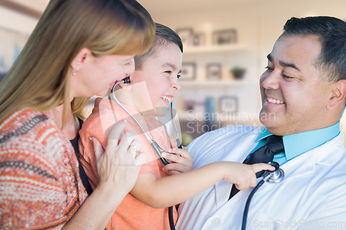 Image of Young Boy and Mother Visiting with Hispanic Doctor in Office