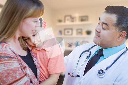 Image of Young Sick Boy and Mother Visiting with Hispanic Doctor in Offic