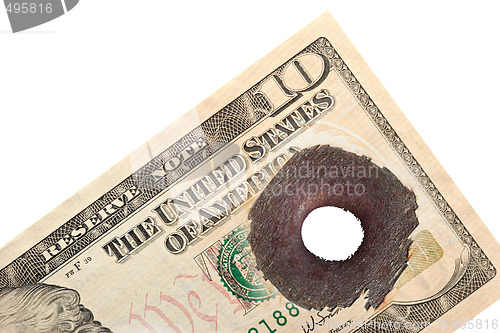 Image of ten dollar with bullet hole