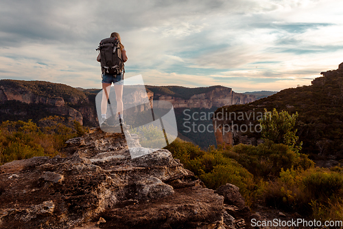 Image of Hiking woman in mountain precipice with extraordinary views