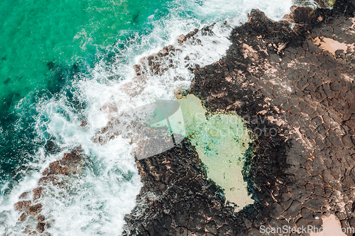 Image of Aerial view of coastal rock pool and ocean