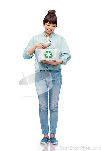 Image of smiling young asian woman sorting metallic waste