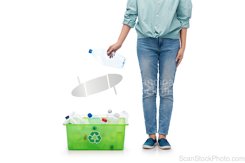 Image of young woman sorting plastic waste
