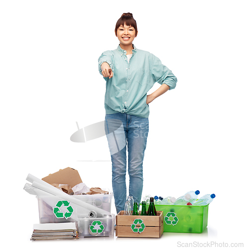 Image of happy woman sorting paper, metal and plastic waste