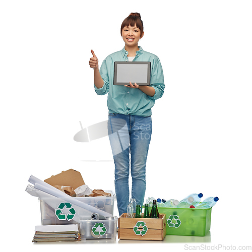 Image of smiling asian woman with tablet pc sorting waste