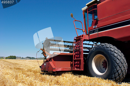 Image of combine harvester on field