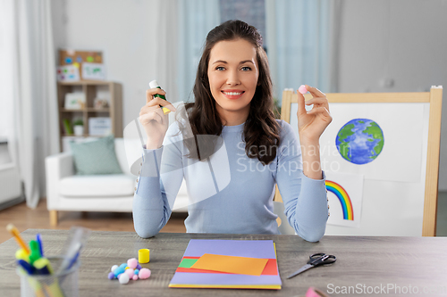 Image of teacher having online class of arts and crafts