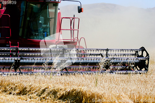 Image of combine harvester on field