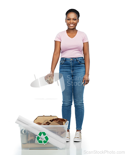 Image of happy african american woman sorting paper waste