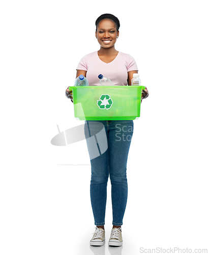 Image of smiling young asian woman sorting plastic waste