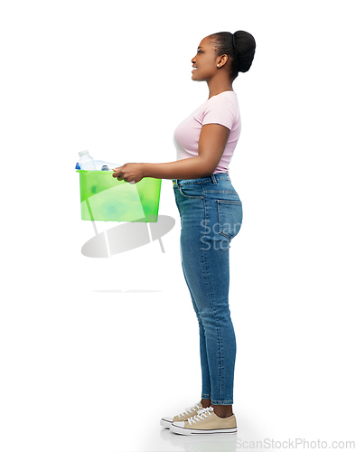 Image of smiling young asian woman sorting plastic waste