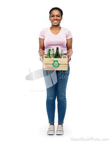 Image of happy african american woman sorting glass waste