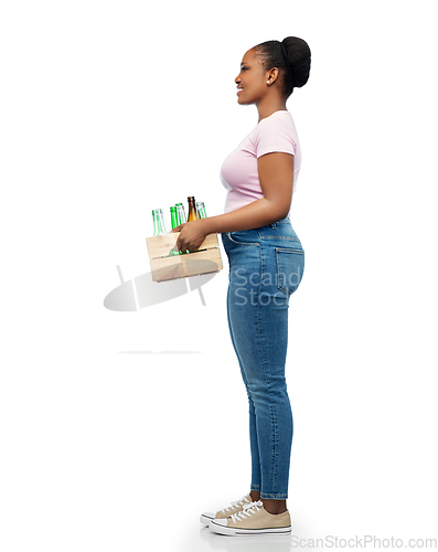 Image of happy african american woman sorting glass waste