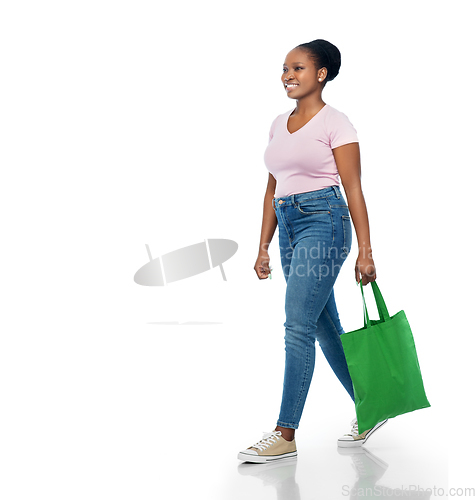 Image of woman with reusable canvas bag for food shopping