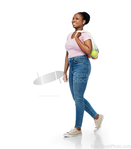 Image of african woman with food in reusable string bag