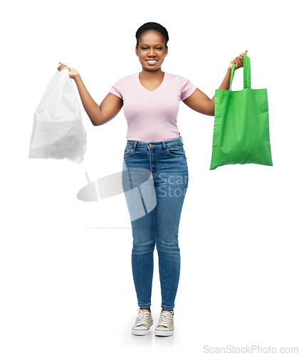 Image of woman comparing reusable and plastic bags