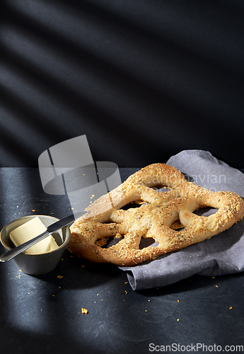 Image of close up of cheese bread, butter and table knife