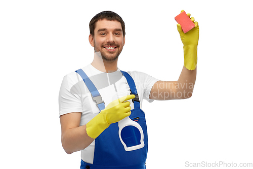 Image of male cleaner cleaning with sponge and detergent