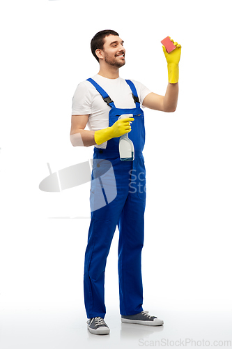 Image of male cleaner cleaning with sponge and detergent