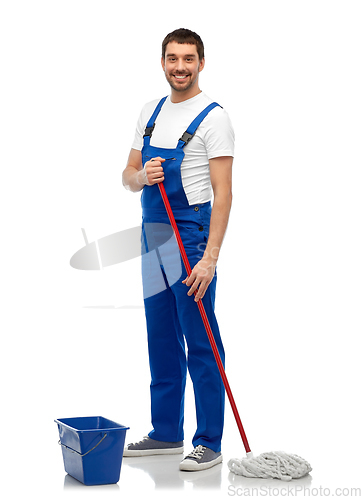 Image of male cleaner cleaning floor with mop and bucket