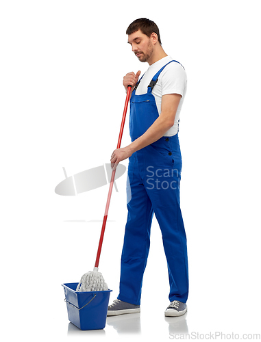 Image of male cleaner cleaning floor with mop and bucket