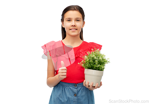 Image of happy girl holding flower in pot showing thumbs up
