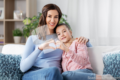 Image of happy smiling mother with daughter at home