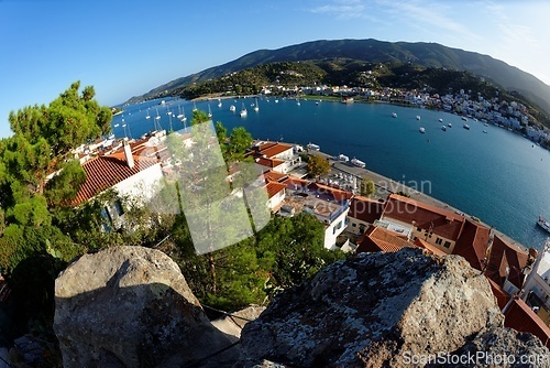 Image of High angle fisheye view of Poros town in Greece in the evening, seen from the bottom of the clock tower