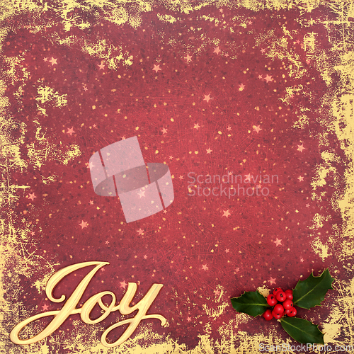 Image of Joy at Christmas New Year Holly Background on Grunge Red