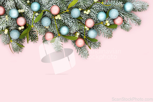 Image of Festive Christmas Pink Background with Snow Fir and Tree Baubles