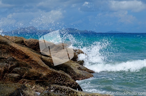 Image of Scenic splashes of surf at Anse Severe beach on La Digue island, Seychelles