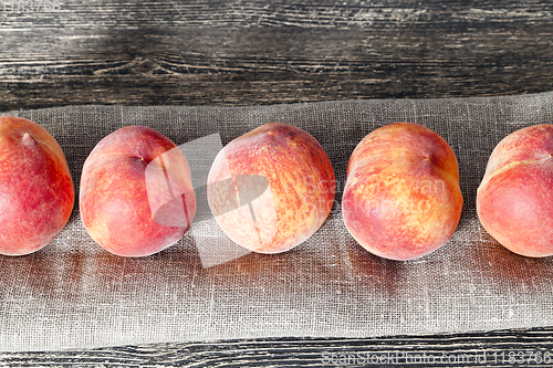 Image of row ripe orange peaches