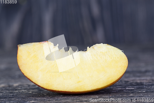 Image of one fresh slice of ripe peach