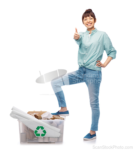 Image of happy smiling asian woman sorting paper waste