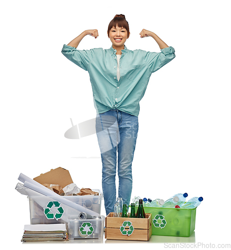 Image of happy woman sorting paper, metal and plastic waste