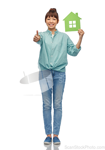 Image of asian woman with green house showing thumbs up