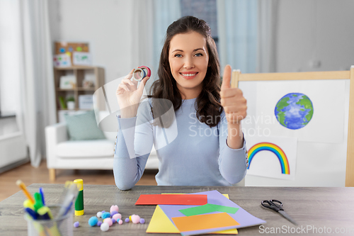 Image of teacher having online class of arts and crafts