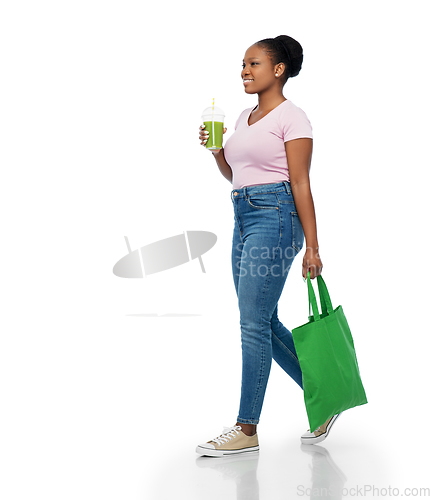 Image of happy woman with drink and food in reusable bag