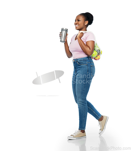 Image of woman with tumbler and food in string bag