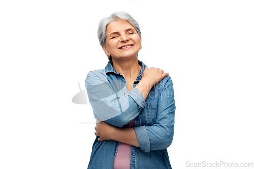 Image of portrait of smiling senior woman in denim shirt