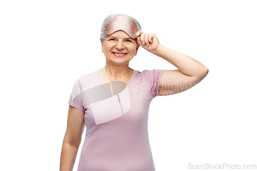 Image of senior woman in pajamas and eye sleeping mask