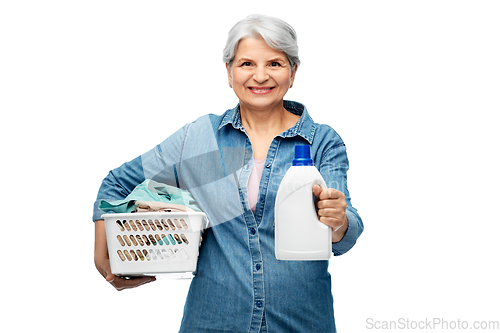 Image of smiling senior woman with laundry basket