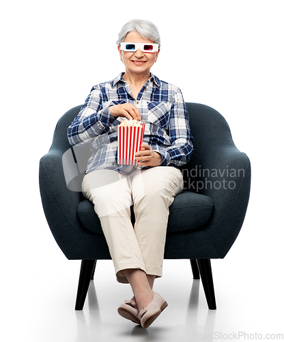 Image of old woman in 3d glasses with popcorn watches movie