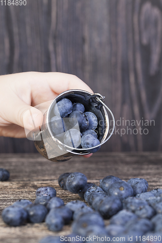 Image of small decorative bucket and berries