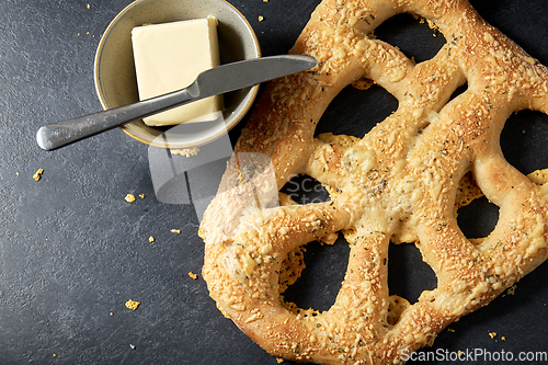 Image of close up of cheese bread, butter and table knife