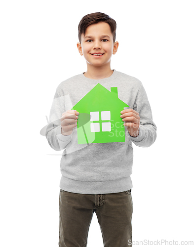 Image of smiling boy holding green house icon