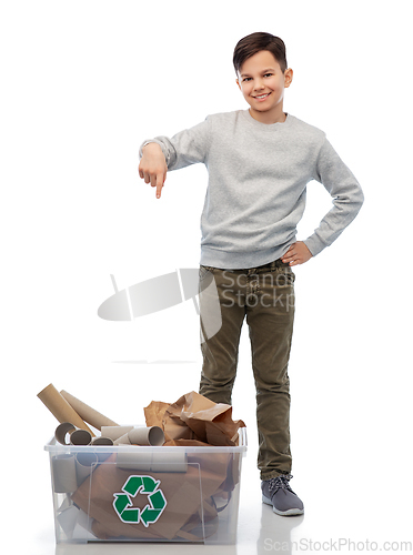 Image of smiling boy sorting paper waste