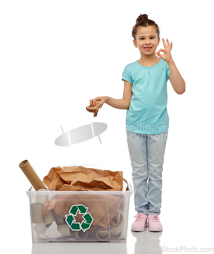 Image of smiling girl sorting paper waste