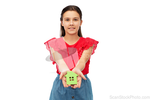 Image of smiling little girl holding green house icon